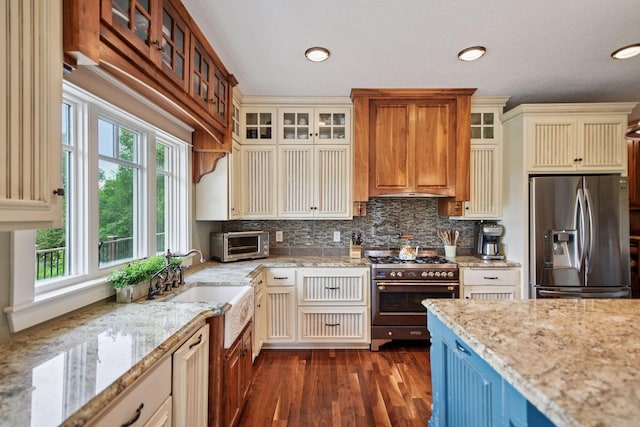 1755 Chateau Way, Minnetrista, MN 55359 - kitchen with stainless steel appliances, plenty of natural light, dark wood-type flooring, decorative backsplash, and recessed lighting