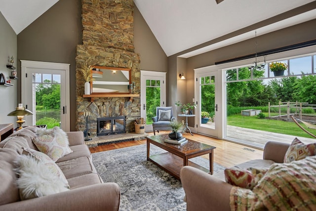 1755 Chateau Way, Minnetrista, MN 55359 - living room with high vaulted ceiling, wood finished floors, and a fireplace