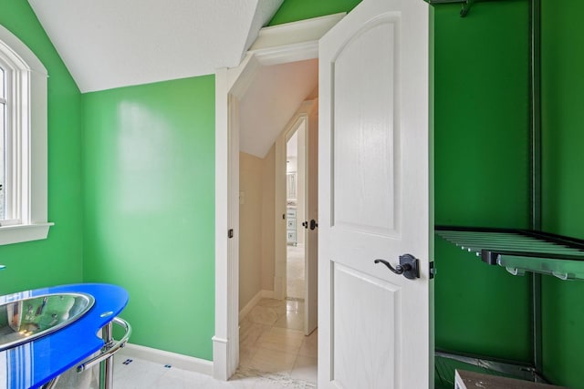 1755 Chateau Way, Minnetrista, MN 55359 - bathroom featuring lofted ceiling and marble look tiles