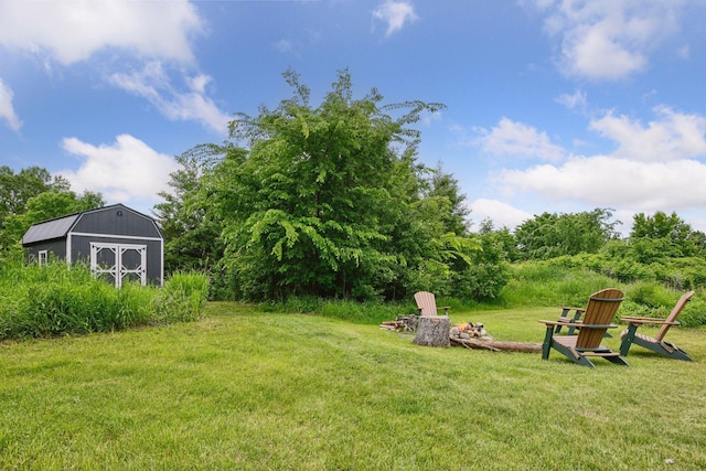 1755 Chateau Way, Minnetrista, MN 55359 - view of green lawn featuring a fire pit and a shed