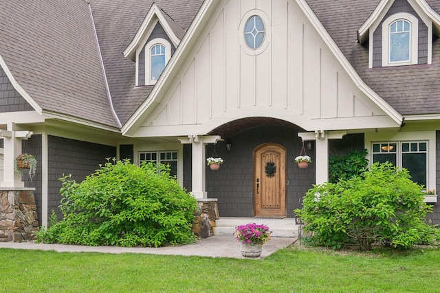 1755 Chateau Way, Minnetrista, MN 55359 - view of front facade featuring board and batten siding, a shingled roof, and a front lawn