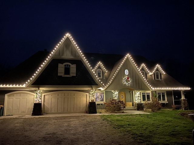 1755 Chateau Way, Minnetrista, MN 55359 - view of front of house featuring driveway, board and batten siding, and a lawn