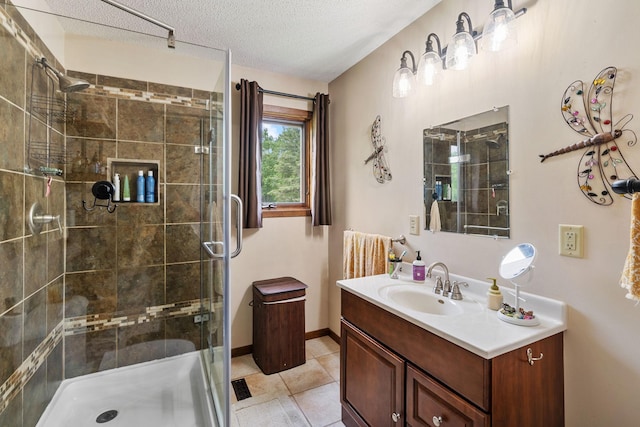 43190 Government Rd, Hinckley, MN 55037 - bathroom with a shower stall, vanity, a textured ceiling, and tile patterned flooring