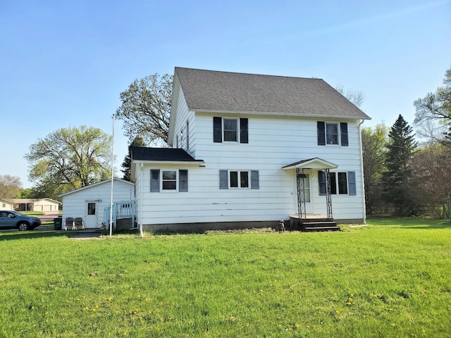 801 Greenwood Ave, Tracy, MN 56175 - colonial inspired home featuring a front yard and roof with shingles
