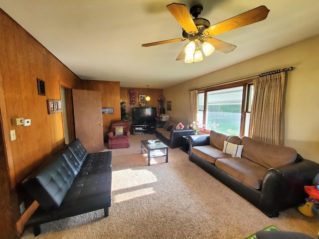 801 Greenwood Ave, Tracy, MN 56175 - living room with carpet, a ceiling fan, and wood walls