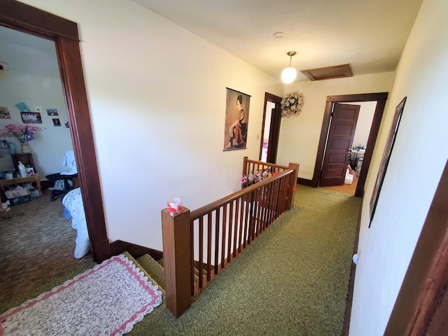 801 Greenwood Ave, Tracy, MN 56175 - hallway featuring an upstairs landing, carpet, attic access, and baseboards
