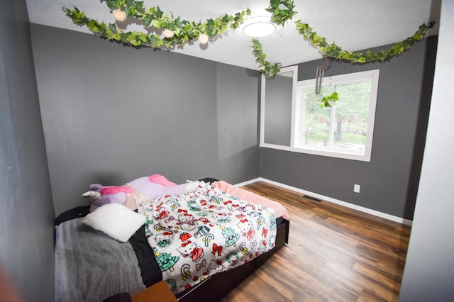 30400 Spruce Dr, Breezy Point, MN 56472 - bedroom featuring wood finished floors and baseboards