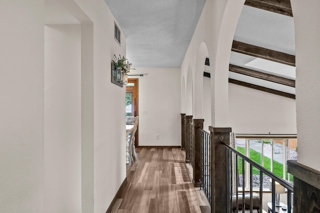 8409 Knollwood Dr, Mounds View, MN 55112 - hall featuring healthy amount of natural light, wood finished floors, and baseboards