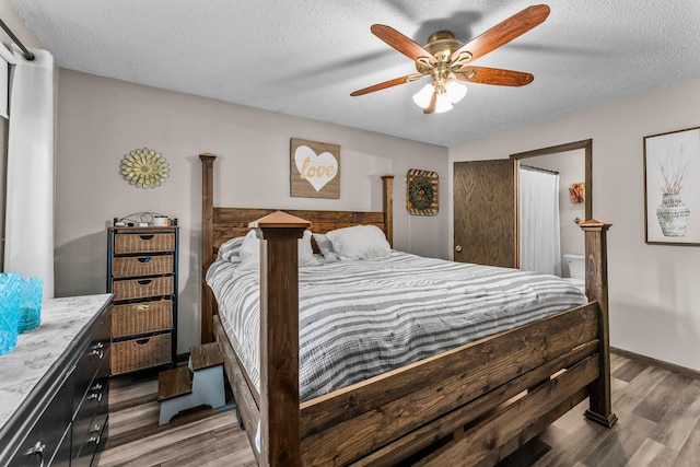 8409 Knollwood Dr, Mounds View, MN 55112 - bedroom featuring wood finished floors, a textured ceiling, and a ceiling fan