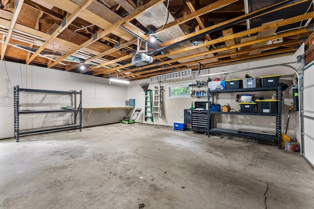 8409 Knollwood Dr, Mounds View, MN 55112 - garage with a workshop area and a garage door opener