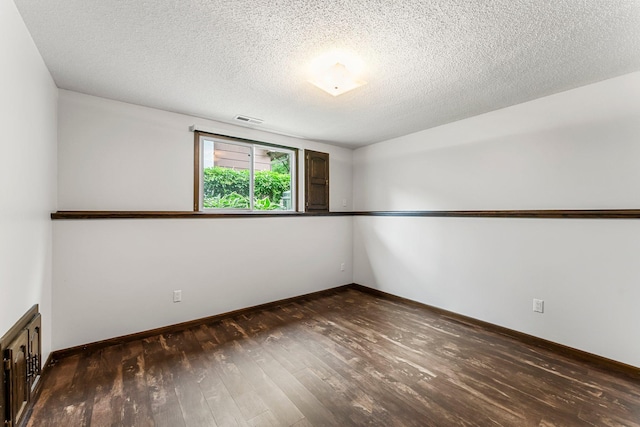 8409 Knollwood Dr, Mounds View, MN 55112 - empty room with hardwood / wood-style floors, baseboards, and a textured ceiling