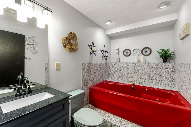8409 Knollwood Dr, Mounds View, MN 55112 - bathroom with a bath, toilet, vanity, and a textured ceiling