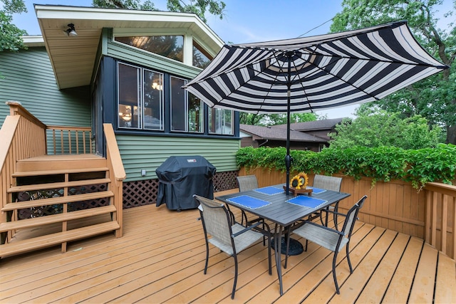8409 Knollwood Dr, Mounds View, MN 55112 - wooden deck featuring area for grilling and outdoor dining space