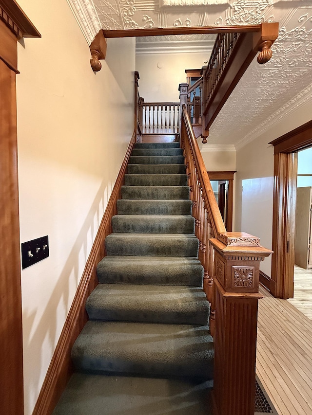 78994 160th St, Sacred Heart, MN 56285 - staircase featuring ornamental molding and wood finished floors