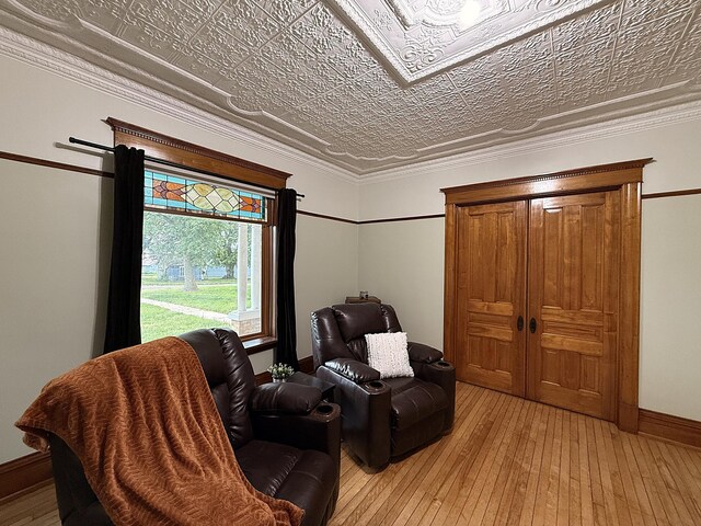 78994 160th St, Sacred Heart, MN 56285 - sitting room featuring light wood finished floors, an ornate ceiling, and baseboards