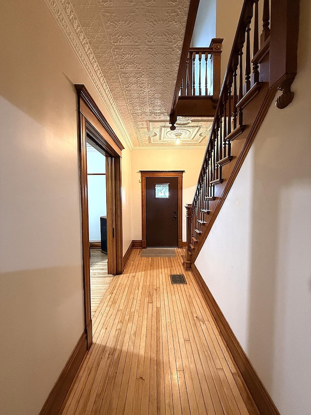 78994 160th St, Sacred Heart, MN 56285 - foyer entrance with an ornate ceiling, wood-type flooring, baseboards, and stairs