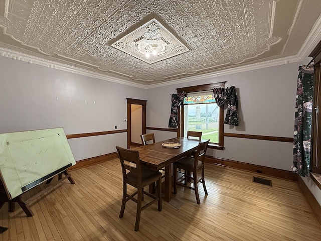 78994 160th St, Sacred Heart, MN 56285 - dining room with an ornate ceiling, light wood-style floors, baseboards, and crown molding