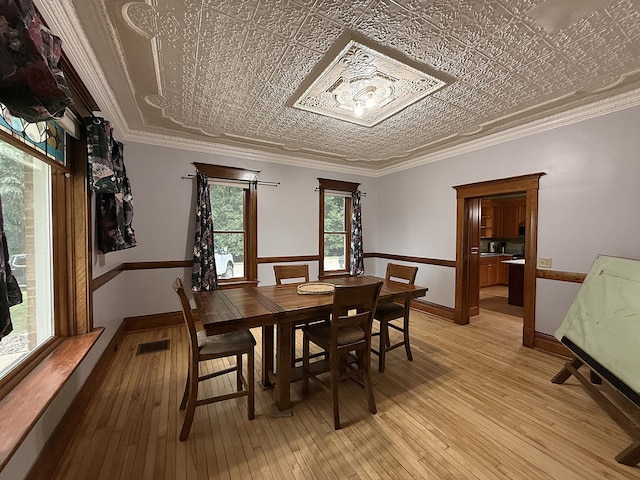 78994 160th St, Sacred Heart, MN 56285 - dining room with light wood-style flooring, baseboards, and an ornate ceiling