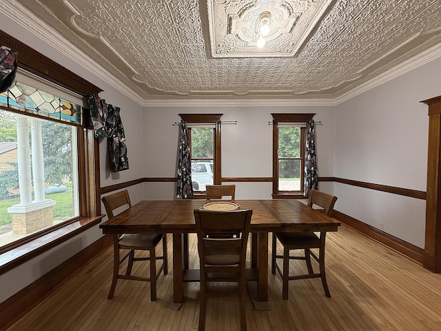 78994 160th St, Sacred Heart, MN 56285 - dining room featuring light wood-style flooring, an ornate ceiling, and baseboards