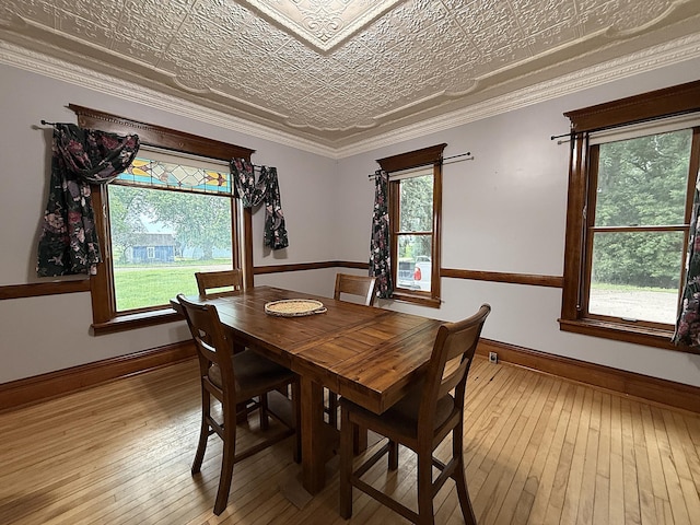 78994 160th St, Sacred Heart, MN 56285 - dining space with an ornate ceiling, healthy amount of natural light, light wood-style floors, and baseboards