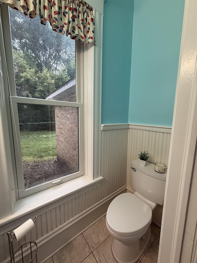 78994 160th St, Sacred Heart, MN 56285 - bathroom with a wainscoted wall, tile patterned floors, and toilet