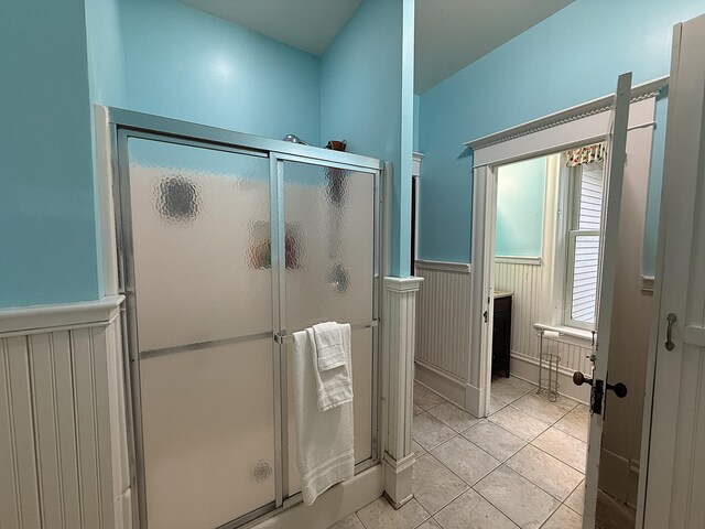 78994 160th St, Sacred Heart, MN 56285 - bathroom featuring a wainscoted wall, a shower stall, and tile patterned flooring