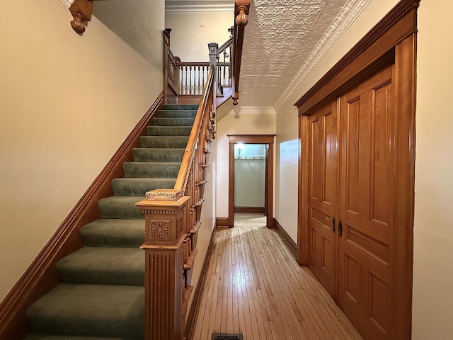 78994 160th St, Sacred Heart, MN 56285 - stairway featuring hardwood / wood-style flooring, ornamental molding, and baseboards