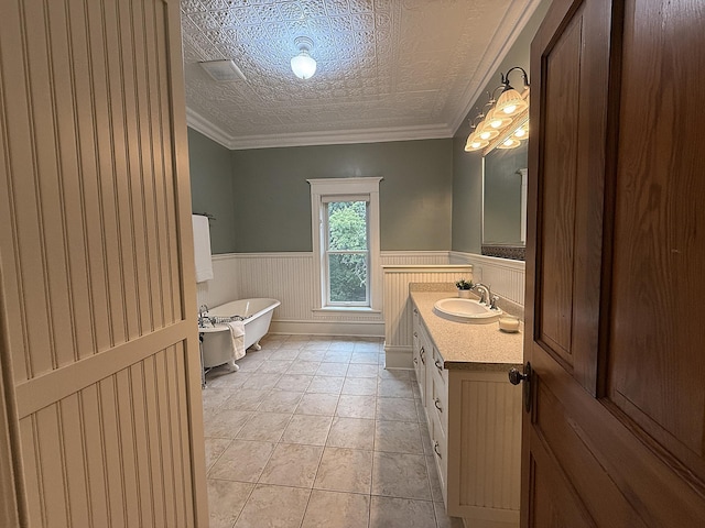 78994 160th St, Sacred Heart, MN 56285 - bathroom with vanity, a freestanding tub, and a wainscoted wall