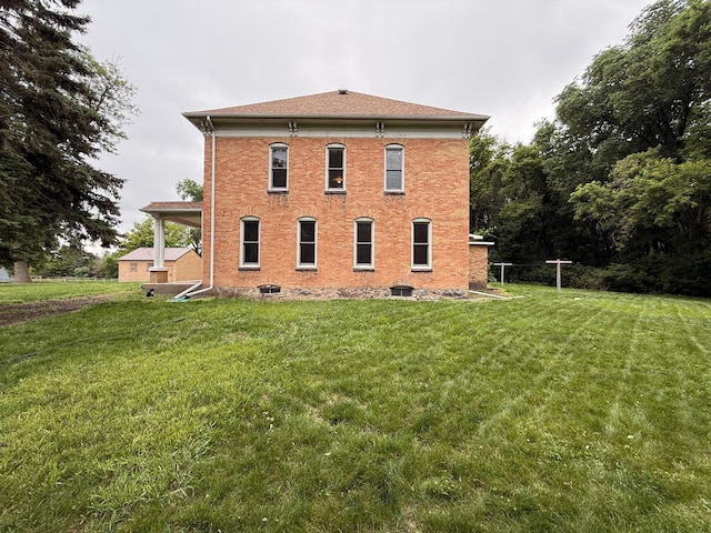 78994 160th St, Sacred Heart, MN 56285 - rear view of house with a lawn and brick siding