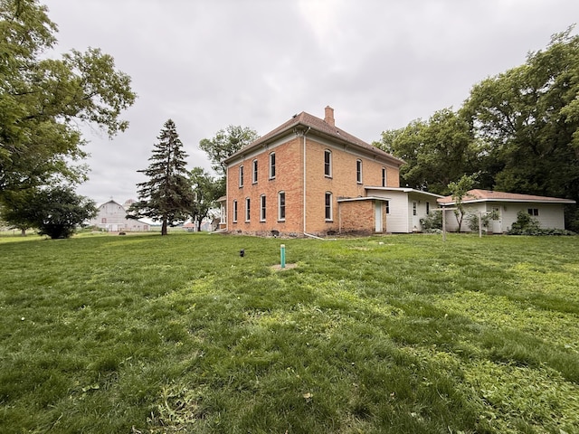 78994 160th St, Sacred Heart, MN 56285 - view of side of home with a chimney and a lawn