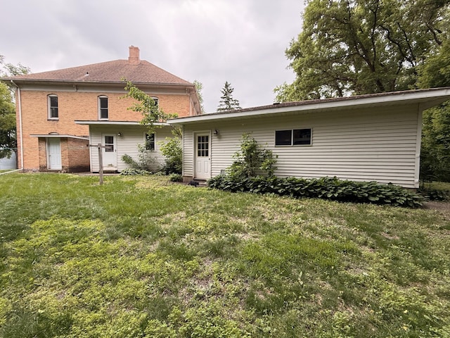 78994 160th St, Sacred Heart, MN 56285 - rear view of property featuring a yard and a chimney