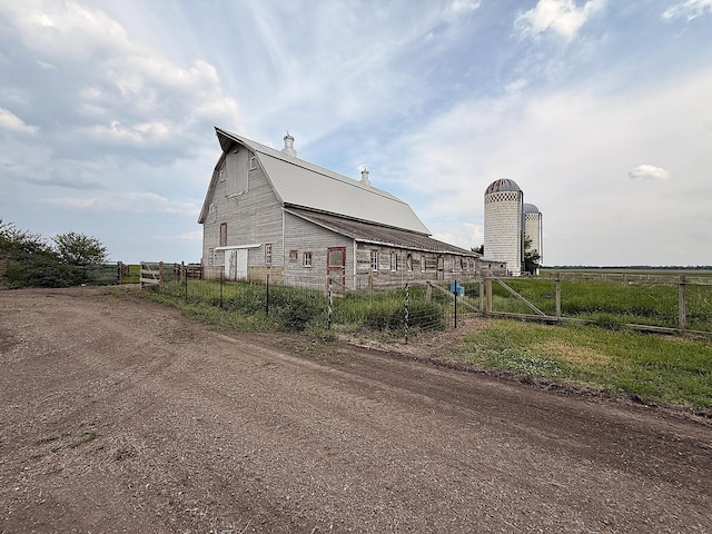78994 160th St, Sacred Heart, MN 56285 - view of side of property with a barn, an outbuilding, metal roof, and dirt driveway
