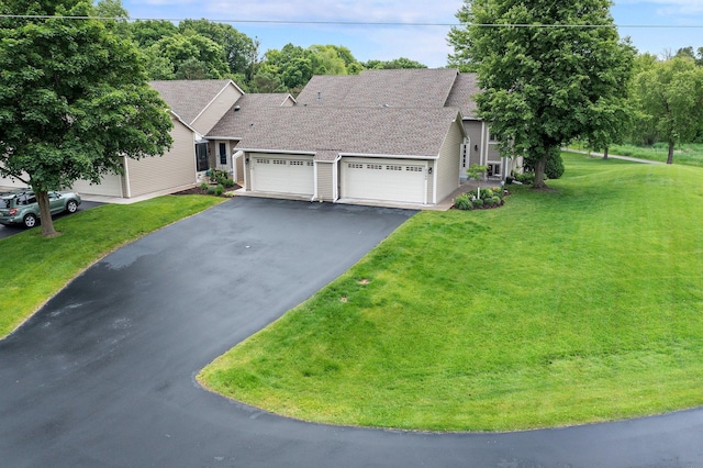 4540 Niagara Ln N, Plymouth, MN 55446 - view of front of property with an attached garage, asphalt driveway, a front yard, and roof with shingles