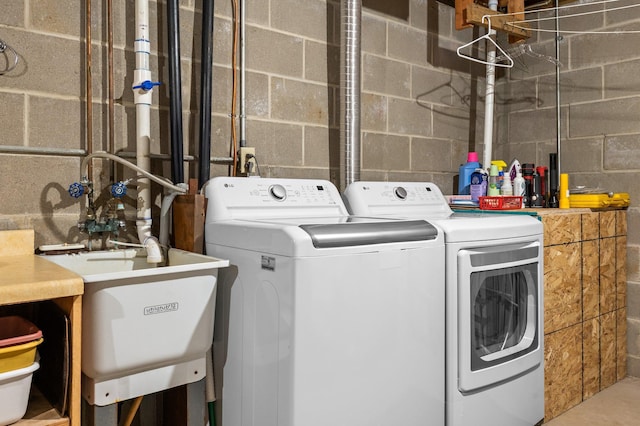 4540 Niagara Ln N, Plymouth, MN 55446 - laundry area featuring independent washer and dryer and concrete block wall
