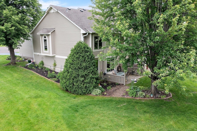 4540 Niagara Ln N, Plymouth, MN 55446 - view of property exterior featuring a lawn, a shingled roof, and a wooden deck