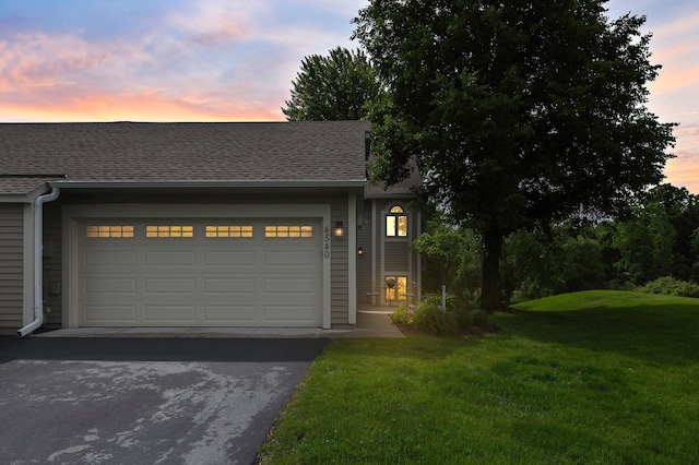 4540 Niagara Ln N, Plymouth, MN 55446 - view of front facade featuring asphalt driveway, a front yard, a shingled roof, and a garage