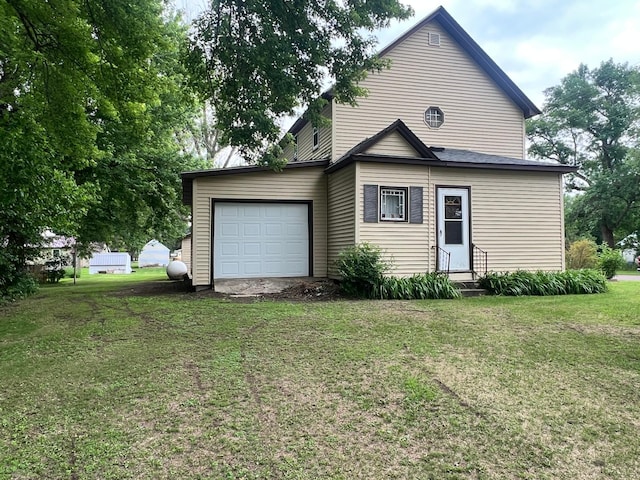 115 1st St, Granada, MN 56039 - view of front of home featuring a front lawn, an attached garage, and entry steps