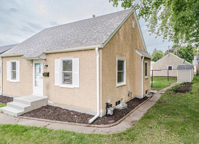 1368 Dale St N, Saint Paul, MN 55117 - view of front of property with stucco siding and roof with shingles