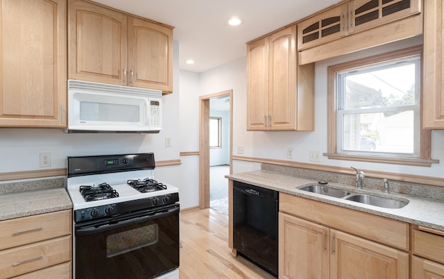 1368 Dale St N, Saint Paul, MN 55117 - kitchen with gas range oven, white microwave, light brown cabinetry, black dishwasher, and recessed lighting