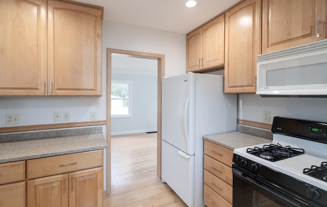 1368 Dale St N, Saint Paul, MN 55117 - kitchen with white appliances, light wood-type flooring, light brown cabinets, recessed lighting, and light countertops