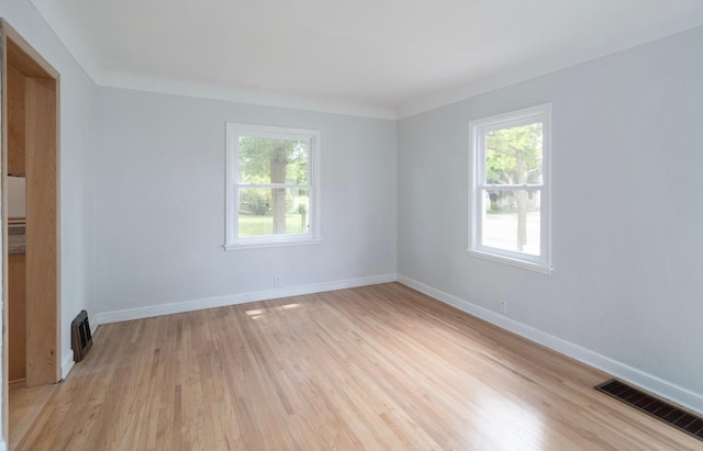 1368 Dale St N, Saint Paul, MN 55117 - unfurnished room featuring healthy amount of natural light and light wood-style floors