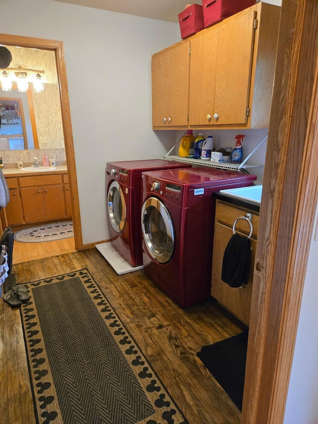 44416 Georgia Ave, Harris, MN 55032 - laundry room with cabinet space, light wood-style floors, and washing machine and clothes dryer