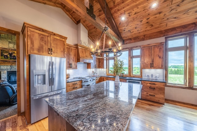 29437 141st Ave, Lanesburgh Twp, MN 56071 - kitchen featuring stainless steel appliances, brown cabinets, a chandelier, wooden ceiling with exposed beams, and light wood finished floors
