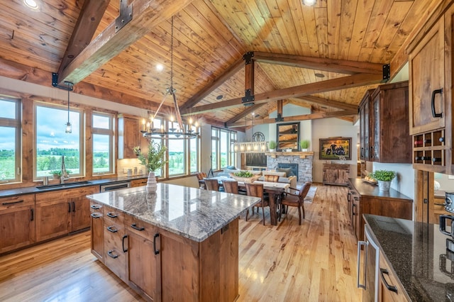 29437 141st Ave, Lanesburgh Twp, MN 56071 - kitchen with a sink, light wood finished floors, wood ceiling, a kitchen island, and brown cabinets
