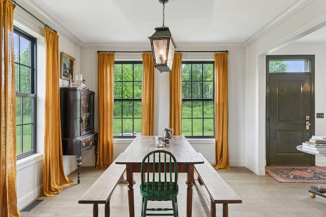 2176 153rd Ave, Mora, MN 55051 - dining room featuring light wood-style floors, baseboards, and ornamental molding