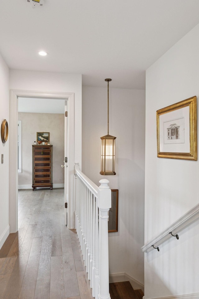 2176 153rd Ave, Mora, MN 55051 - hallway featuring an upstairs landing, light wood finished floors, baseboards, and recessed lighting