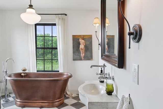 2176 153rd Ave, Mora, MN 55051 - bathroom with a soaking tub, tile patterned floors, vanity, and baseboards