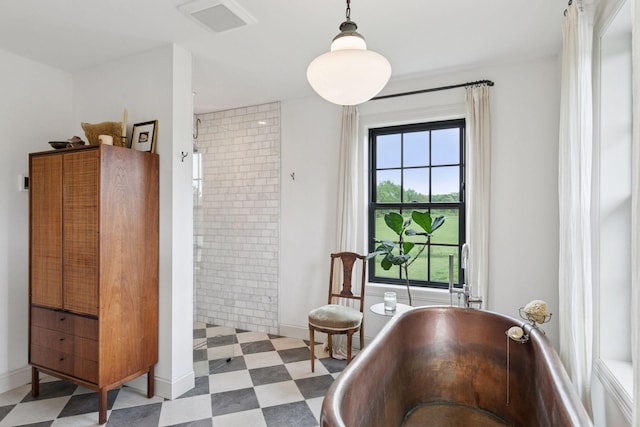 2176 153rd Ave, Mora, MN 55051 - full bath with tile patterned floors, a freestanding bath, and baseboards