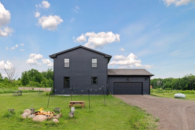 2176 153rd Ave, Mora, MN 55051 - view of property exterior with an outdoor fire pit, driveway, and a garage