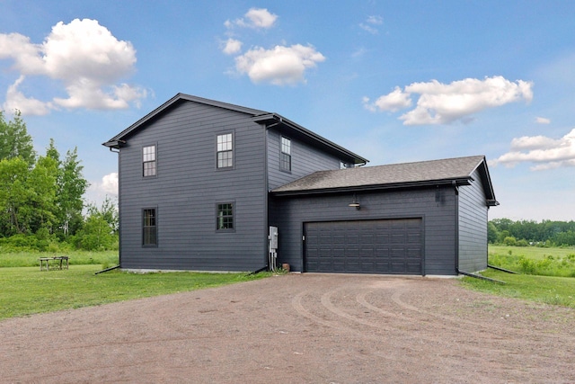 2176 153rd Ave, Mora, MN 55051 - view of property exterior with dirt driveway, a yard, and an attached garage